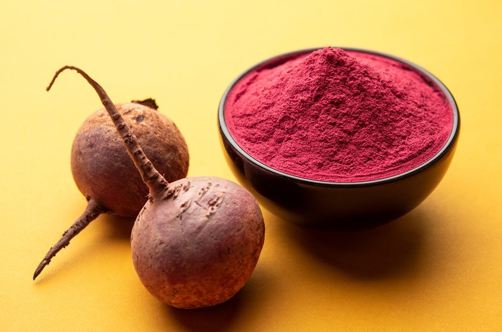 Heap of Beetroot or Beet Root powder with raw whole contains the essential minerals iron, potassium, and magnesium